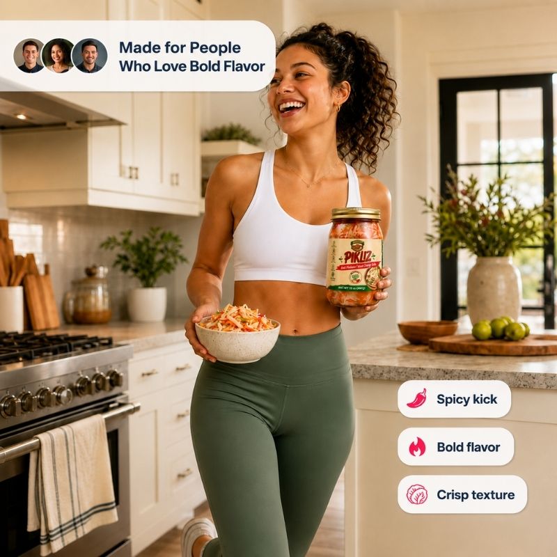 A woman in a white sports bra and green leggings stands in a bright kitchen, holding a bowl of salsa and a jar of AbondiZ Gourmet Pikliz . Text overlays highlight the product's benefits: 'Made for People Who Love Bold Flavor' and 'Spicy kick, Bold flavor, Crisp texture'.